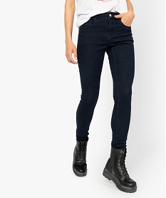 jean femme coupe slim contenant du polyester recycle bleuA455501_1