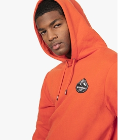 sweat homme a capuche en jersey molletonne imprime orangeA967001_1